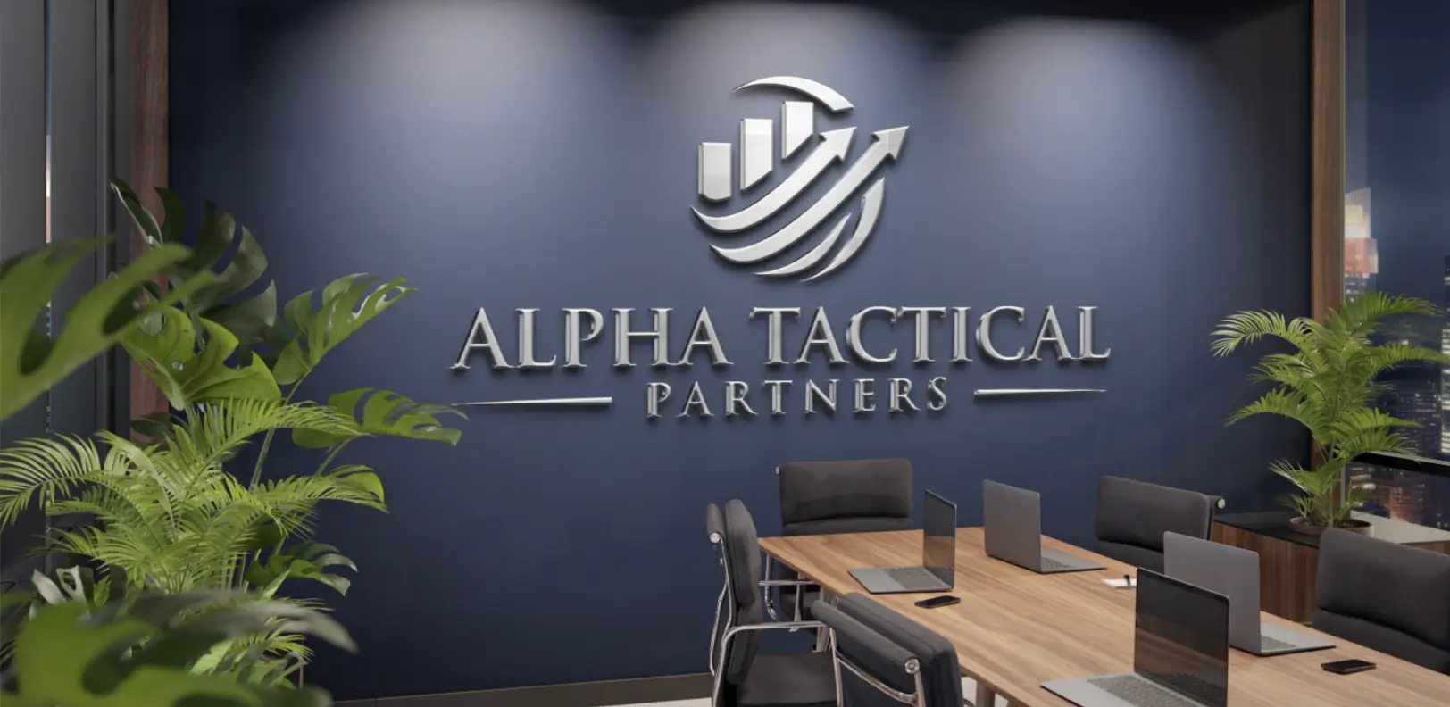Silver office logo on navy wall above a modern meeting table.